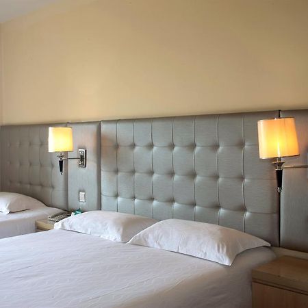Qingdao Renjia Bussiness Hotel Екстер'єр фото
