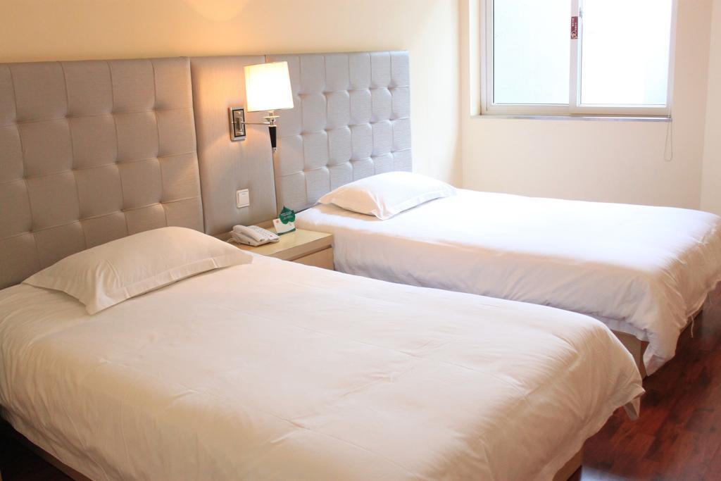 Qingdao Renjia Bussiness Hotel Номер фото