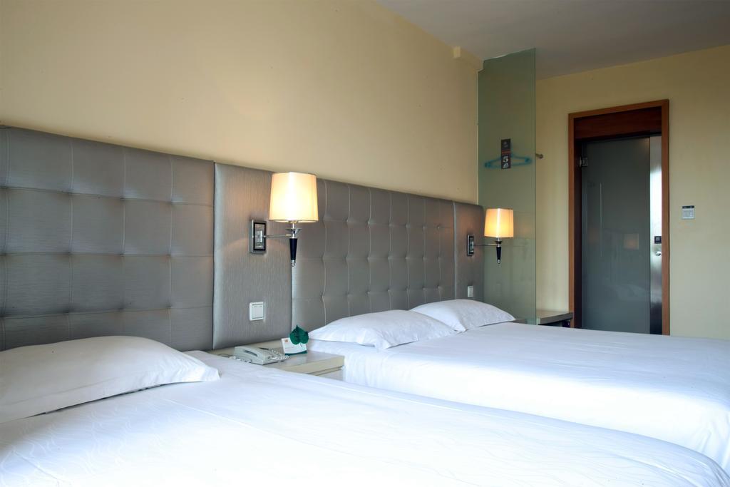 Qingdao Renjia Bussiness Hotel Екстер'єр фото